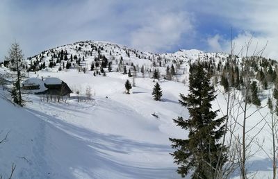 Scenic view of snow covered mountains against sky