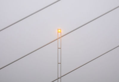 Low angle view of street light against clear sky