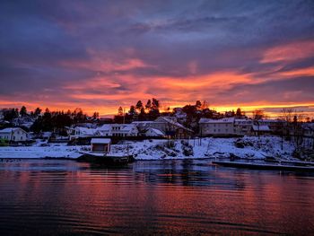 Scenic view of frozen lake against sky during sunset