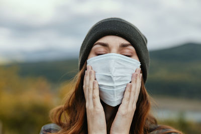 Woman wearing face mask outdoors