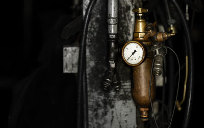 Golden brass workshop equipment in dark garage