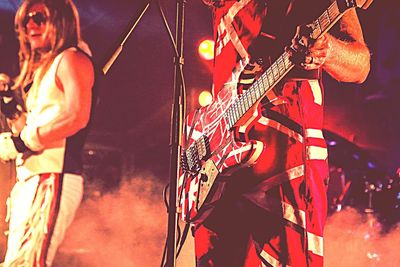 View of illuminated people at night