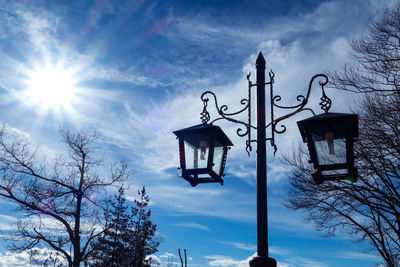 Low angle view of street light against sky