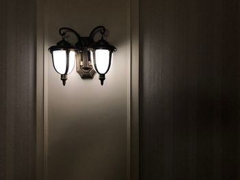 Close-up of lamp hanging on door