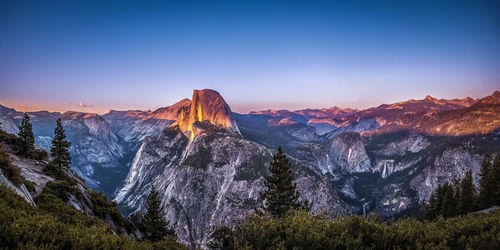 Scenic view of landscape against sky at sunset