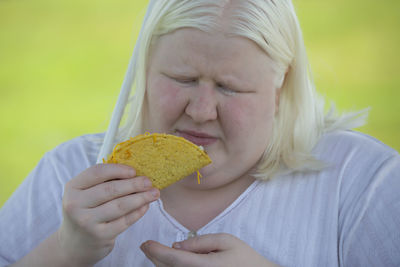 Close-up of woman eating food