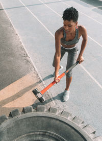 High angle view of man skateboarding on road