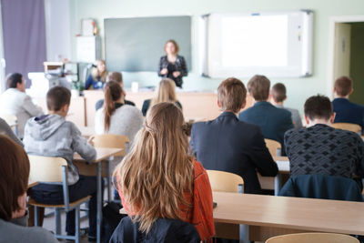 Group of people sitting in classroom