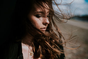 Close-up of woman with tousled hair