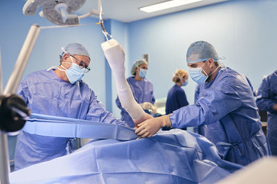 Doctors team working in operation room at hospital