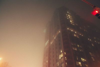 Low angle view of illuminated city at night