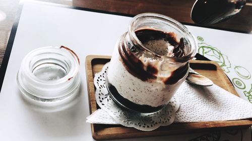 High angle view of ice cream in jar on table