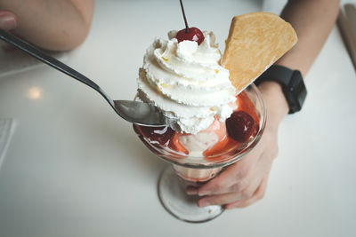 Midsection of person holding ice cream cone