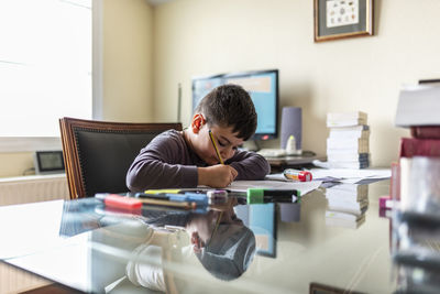 Man sitting on table at home