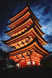 Low angle view of pagoda against sky at night