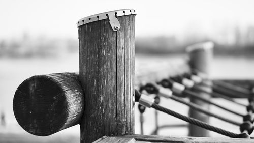 Close-up of wooden post on railing