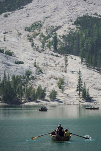 People on boat in river