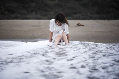 Full length of boy on sand at beach