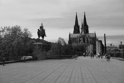 Statue in front of historical building