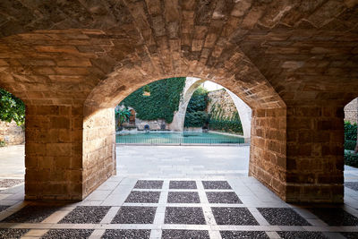 View of historical building seen through archway