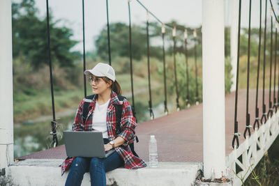 Portrait of young woman using mobile phone