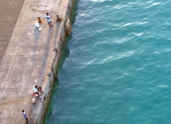 High angle view of people enjoying in water