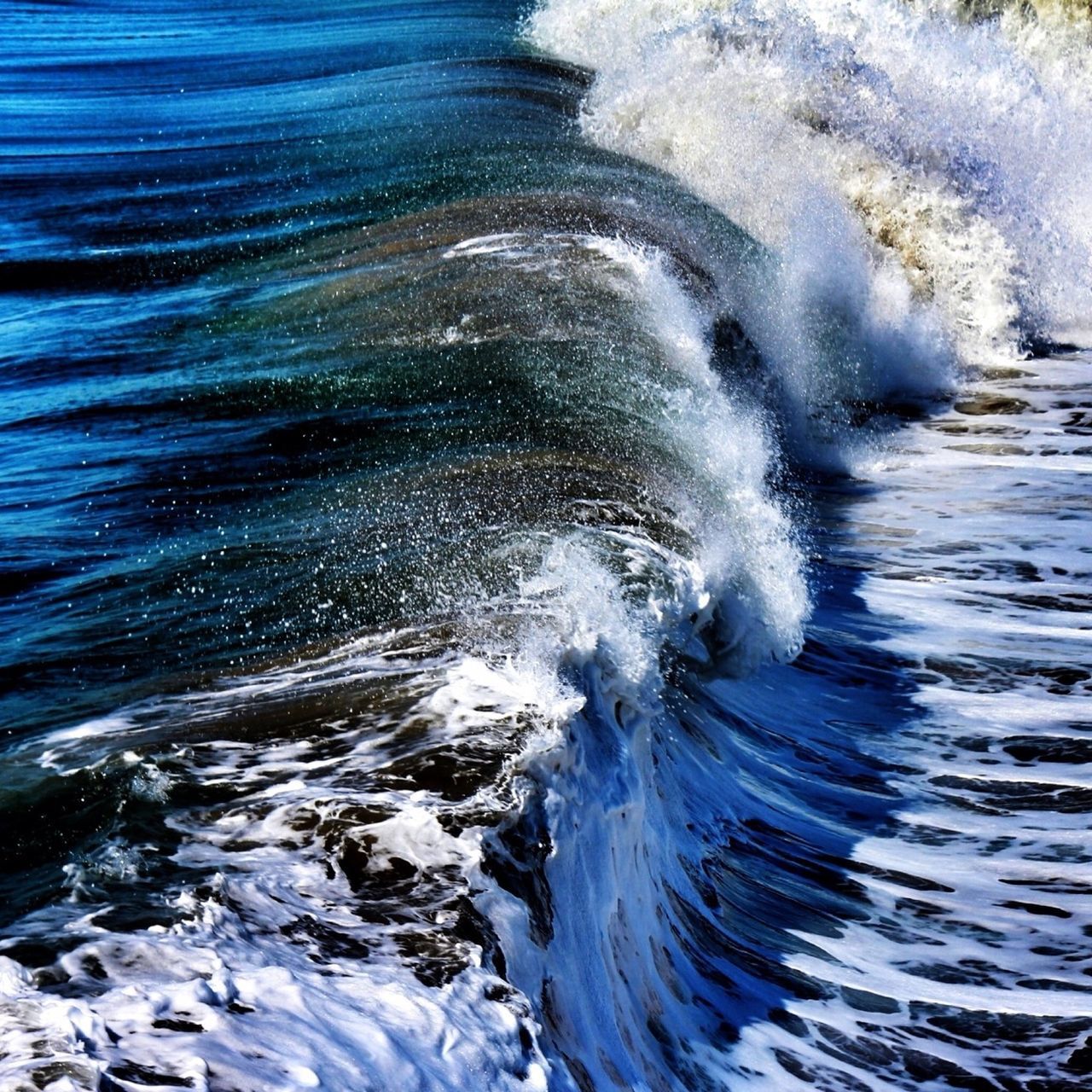 water, motion, sea, rippled, waterfront, splashing, wave, surf, flowing water, nature, beauty in nature, rock - object, high angle view, long exposure, power in nature, no people, outdoors, day, flowing, blue