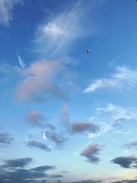 Low angle view of airplane flying in sky