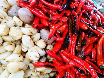 Close-up of fried red chili peppers and garlic cloves for sale