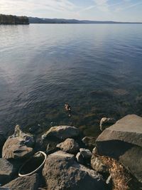 Scenic view of sea and rocks against sky