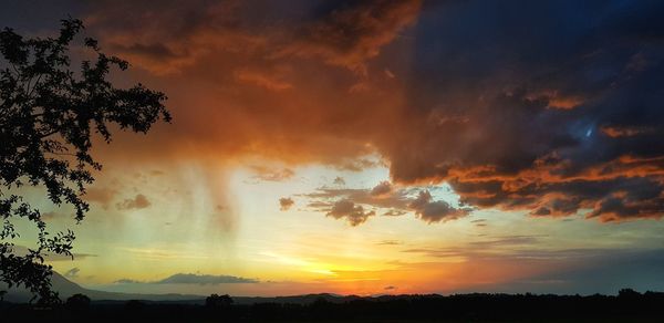 Scenic view of dramatic sky during sunset