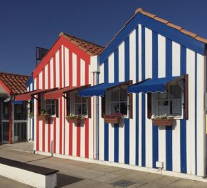 Row of multi colored building against blue sky