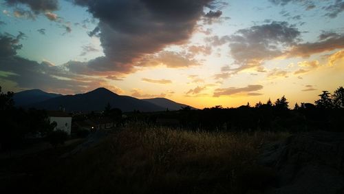 Silhouette of mountain against sky at sunset