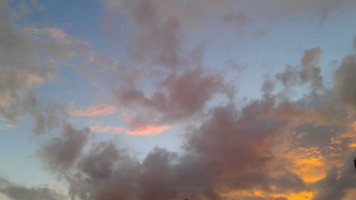 Low angle view of dramatic sky during sunset