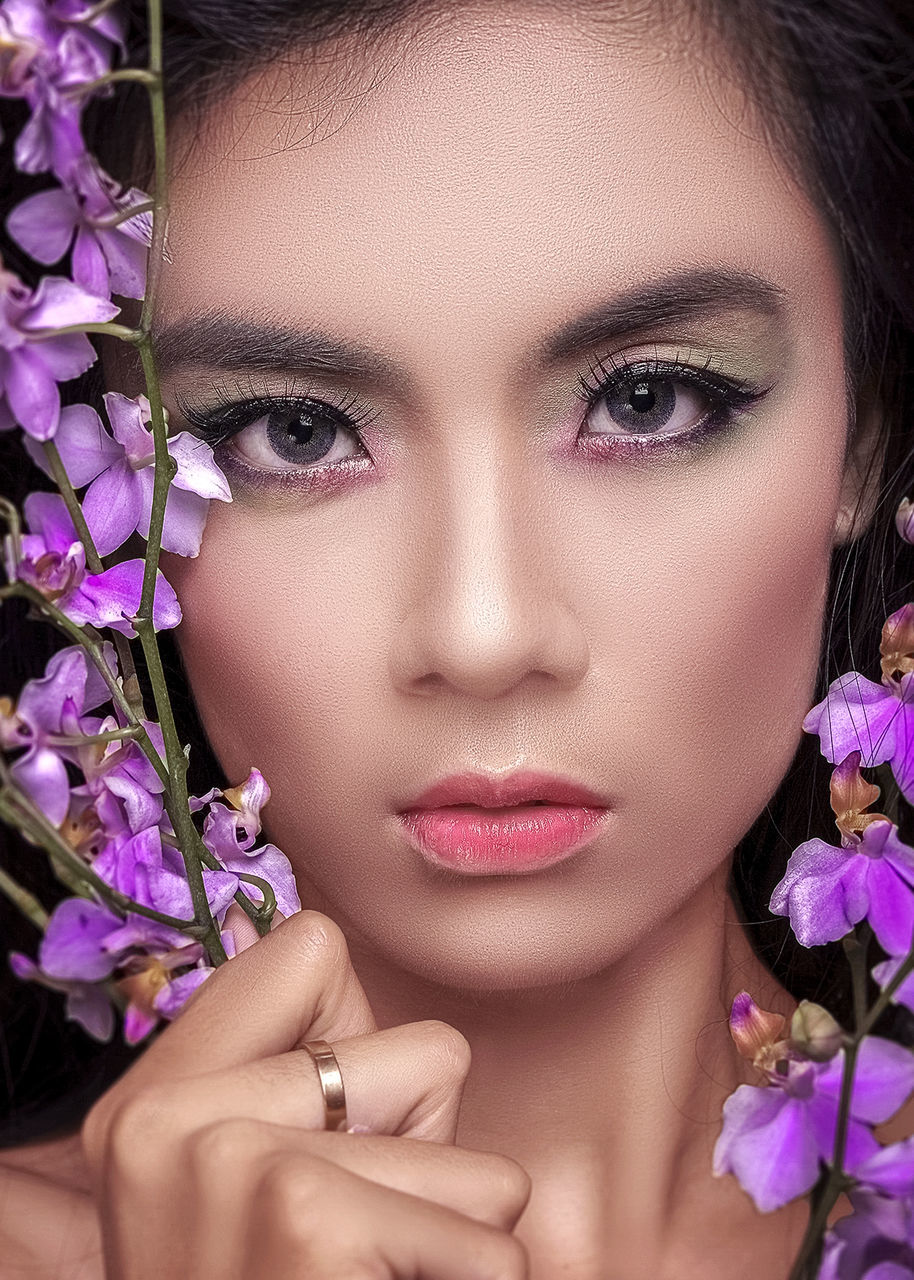 flower, beauty, flowering plant, make-up, fashion, young adult, portrait, headshot, human body part, body part, beautiful woman, women, close-up, beauty in nature, plant, beautiful people, human face, glamour, fashion model, lipstick, pink color, purple, hand