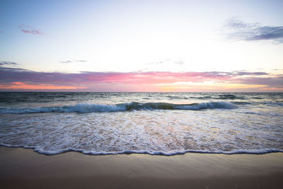 Scenic view of sea at sunset