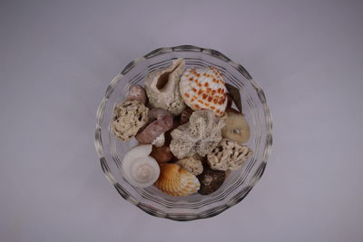 High angle view of breakfast on table against white background