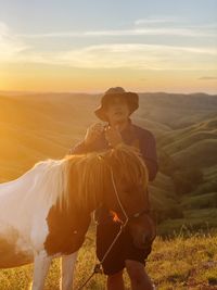 View of a horse standing on mountain land