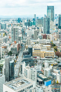 High angle view of modern buildings in city against sky