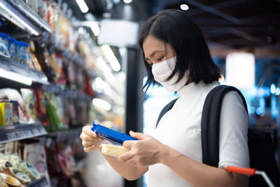 Midsection of woman standing in store
