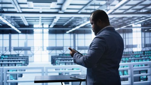 Side view of businessman standing in office