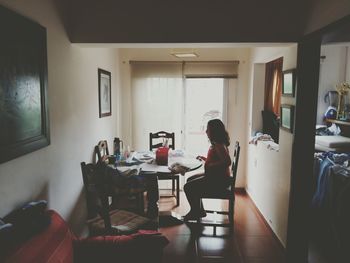 Man sitting on table at home