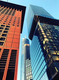 Low angle view of modern buildings against clear sky