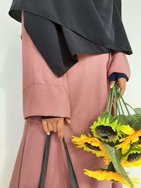 Close-up of man holding umbrella