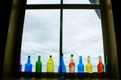 Low angle view of glass window against sky