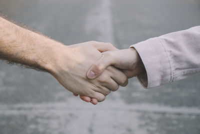 Close-up of man holding hands