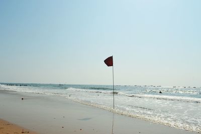 Scenic view of beach against clear sky