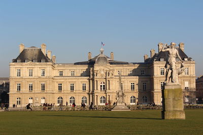 Buildings against clear blue sky