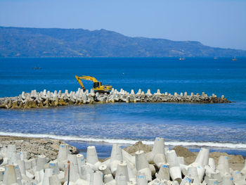 Scenic view of sea against clear blue sky