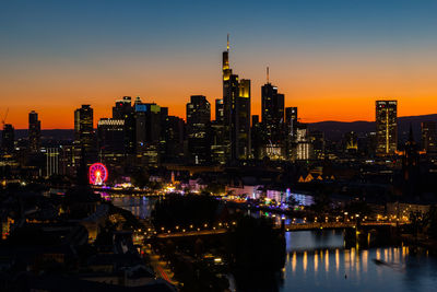 Skyline frankfurt with mainfest at the river with carusels and giant wheel